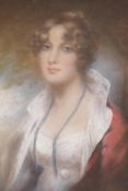 A portrait of a woman in a red coat, unsigned, pastel on paper in a carved giltwood frame (lacks