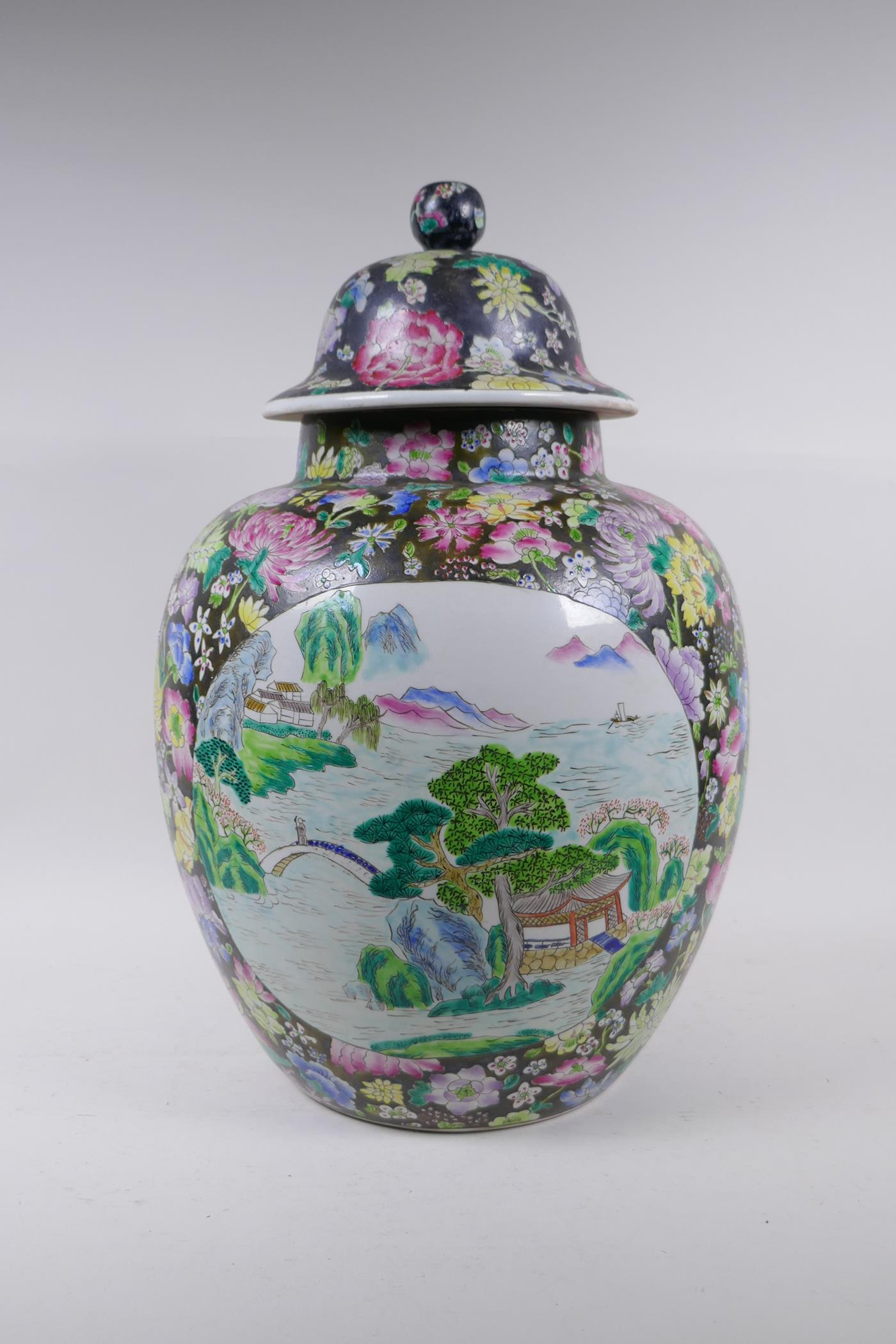 A Chinese famille noire jar with millefiori decoration and painted landscape panels, seal mark to