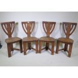 A set of four oak Arts and Crafts chairs