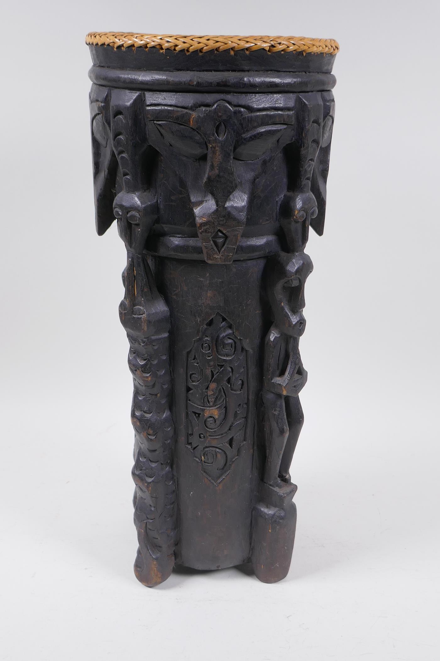 An Indonesian Dayak tribal carved and ebonised wood stick stand with figural and animal - Image 2 of 6