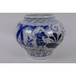 A Chinese blue and white porcelain jar decorated with figures and foliage with glazed character