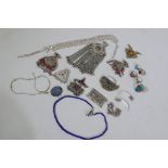 A collection of Middle Eastern/Turkmen white metal pendants and jewellery