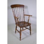 A late C19th/early C20th Windsor armchair with an elm seat