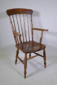 A late C19th/early C20th Windsor armchair with an elm seat