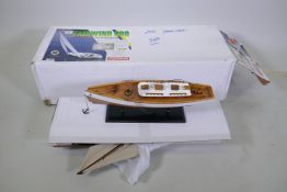 A Japanese Kyosho 'Fairwind 900' radio controlled sailing yacht, and a scratch built model of a