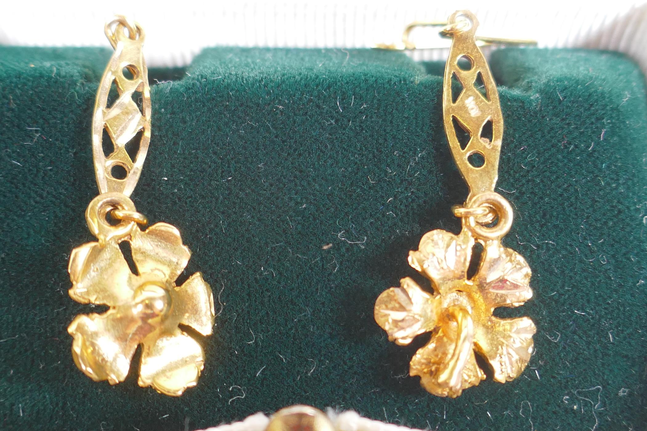 A pair of 10ct gold leaf pattern earrings, 3.2g, and a collection of gilt metal earrings including - Image 2 of 7