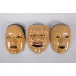 Three Japanese papier mache Noh masks, 22cm