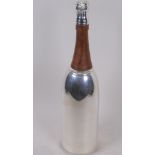 A silver plated cocktail shaker in the form of a Champagne bottle, 37.5cm high
