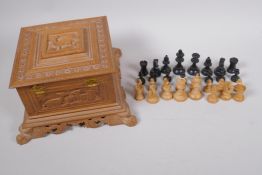 A boxwood chess set, kings 6cm high, in a carved sandalwood jewellery box, 18cm square