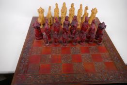 A large composition chess set with board, kings 17cm high, (two pawns missing)