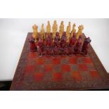 A large composition chess set with board, kings 17cm high, (two pawns missing)