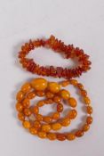 A string of butterscotch amber beads, AF, 50cm long, and a Baltic amber bangle, total 200g