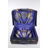 A 1920s lady's travel vanity case with a Walker and Hall silver brush and mirror set, Sheffield
