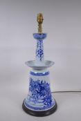 A Chinese blue and white porcelain candlestick with floral decoration, converted to a lamp, 54cm