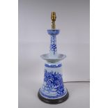 A Chinese blue and white porcelain candlestick with floral decoration, converted to a lamp, 54cm