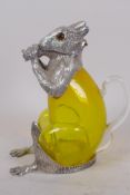 A vaseline glass and silver plated decanter in the form of a squirrel, with glass eyes, 18.5cm high