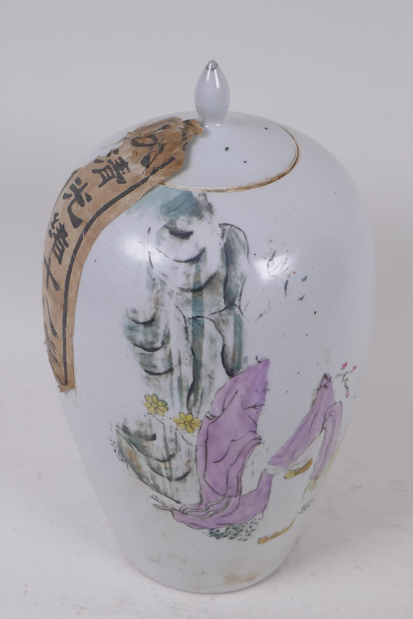 A Chinese porcelain tea jar and cover, sealed with a calligraphy label, 26cm high