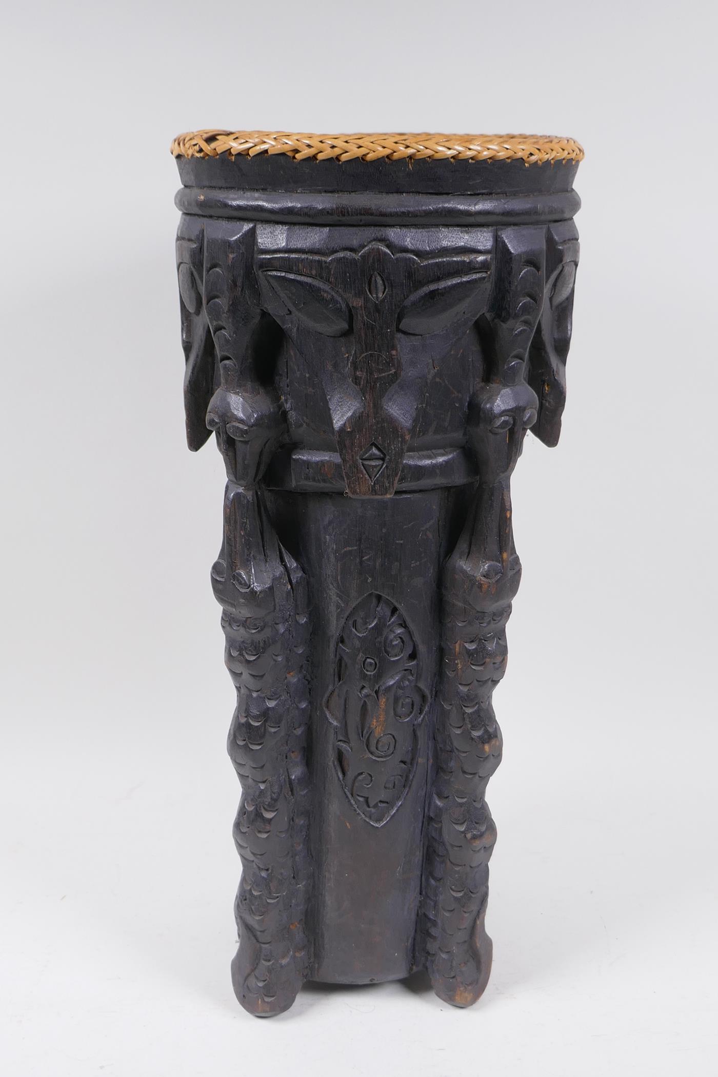 An Indonesian Dayak tribal carved and ebonised wood stick stand with figural and animal - Image 3 of 6