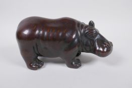 A filled bronze hippopotamus, 20cm long