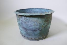 An antique copper bin, drilled for drainage, 53cm diameter