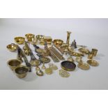 A quantity of horse brasses, taper sticks, brass ware etc