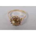 A 14ct gold dress ring set with central yellow sapphire surrounded by diamonds, size N/O