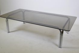 A chromed metal and smoked glass contemporary coffee table, 150cm x 74cm, 38cm high