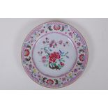 A C19th Chinese famille rose porcelain cabinet plate with floral decoration, 23cm diameter