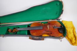 A violin with two piece back and ebony pegs, 60cm long, with bow in hard case