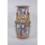 A C19th Canton enamelled porcelain vase, with raised gilt fo-dog handles and dragon mounts, and
