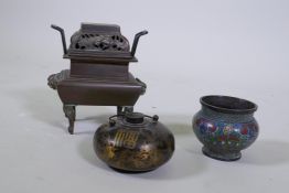 A Chinese metal pot with screw cover and parcel gilt decoration, a cloisonne enamel bronze pot, a