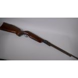 A vintage air rifle with carved wood stock, 112cm long, AF