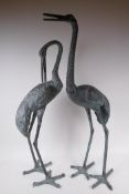 A pair of metal garden cranes, 81cm high