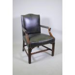 A Georgian style humpback leather open armchair on square fluted legs