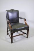 A Georgian style humpback leather open armchair on square fluted legs