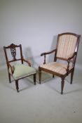 A C19th French walnut elbow chair with panel back and scroll arms, raised on turned tapering