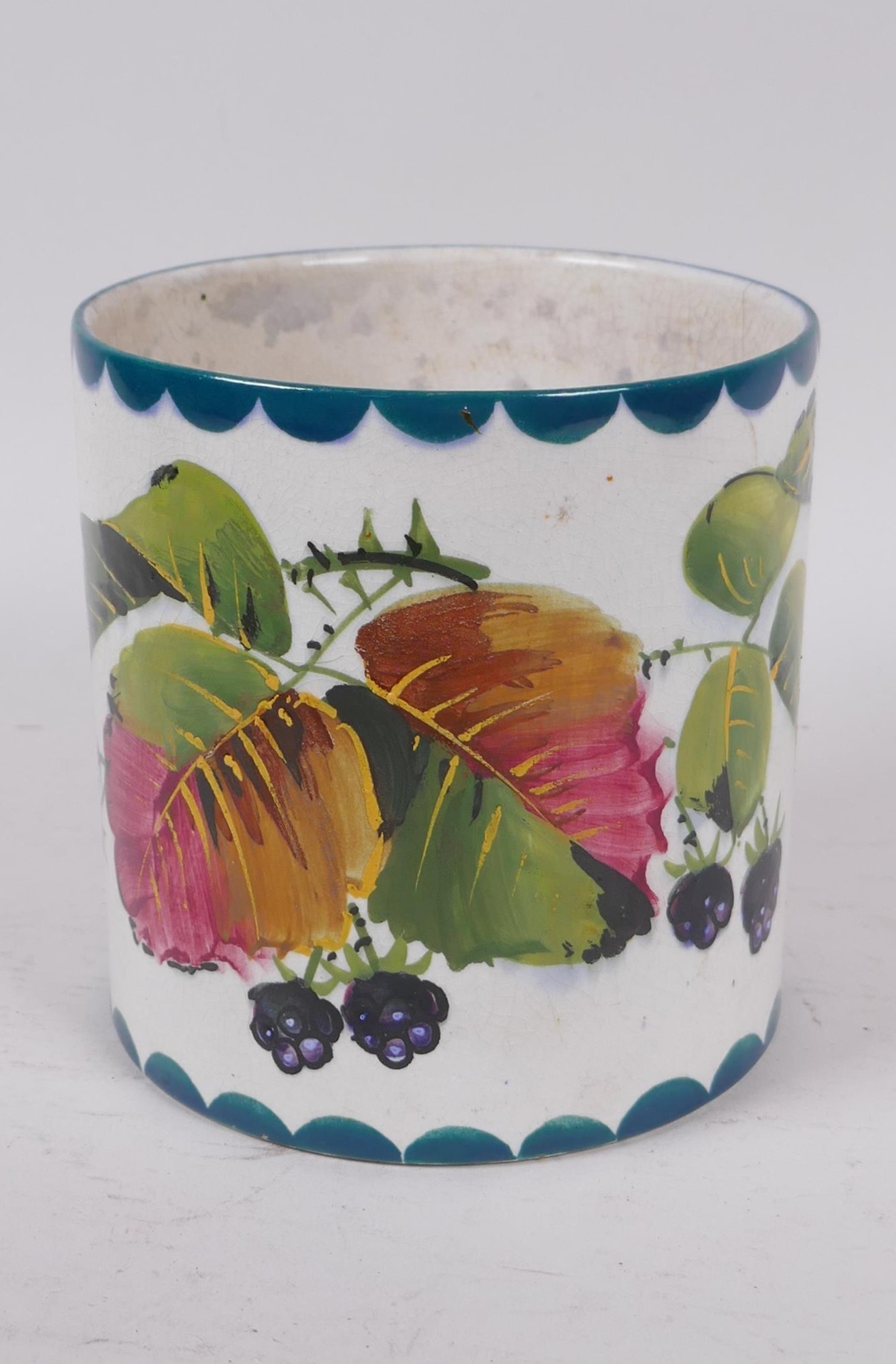 A Wemyss pottery vase decorated with blackberries, retailed by Thos. Goode, AF, 13cm high