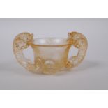 A Chinese glass libation cup with two kylin handles, 10 x 6cm