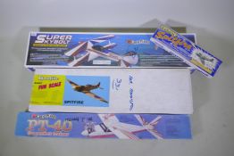 Four model aircraft, 'Great Planes Super Skybolt', 'Great Planes PT-40', a 'Dynaflite Giant Fun