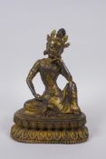 A Sino Tibetan gilt bronze figure of Buddha, 20cm high