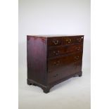 A George III mahogany chest of three over three drawers, fitted with brass swan neck handles and