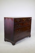 A George III mahogany chest of three over three drawers, fitted with brass swan neck handles and