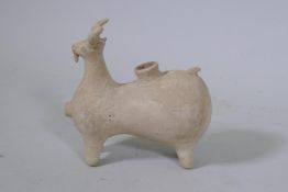 A Middle Eastern unglazed terracotta vessel in the form of a goat, 19cm high