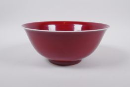 A Chinese Sang de Boeuf glazed porcelain bowl, Xuande 6 character mark to base, 21cm diameter