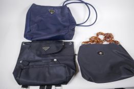 A Prada fabric shoulder bag, 27cm wide, a Prada fabric back pack (1 broken zip) and a leather