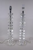 A pair of faceted glass side lamps, 55cm high