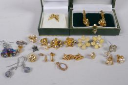 A pair of 10ct gold leaf pattern earrings, 3.2g, and a collection of gilt metal earrings including