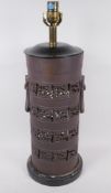 An oriental bronze table lamp base with pierced decoration and ring handles, 56cm high
