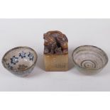 Two Japanese Meiji earthenware footed tea bowls, with painted decoration and a soapstone seal, the