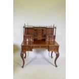 A C19th mahogany desk, the upper section with gallery and four drawers raised on barleytwist